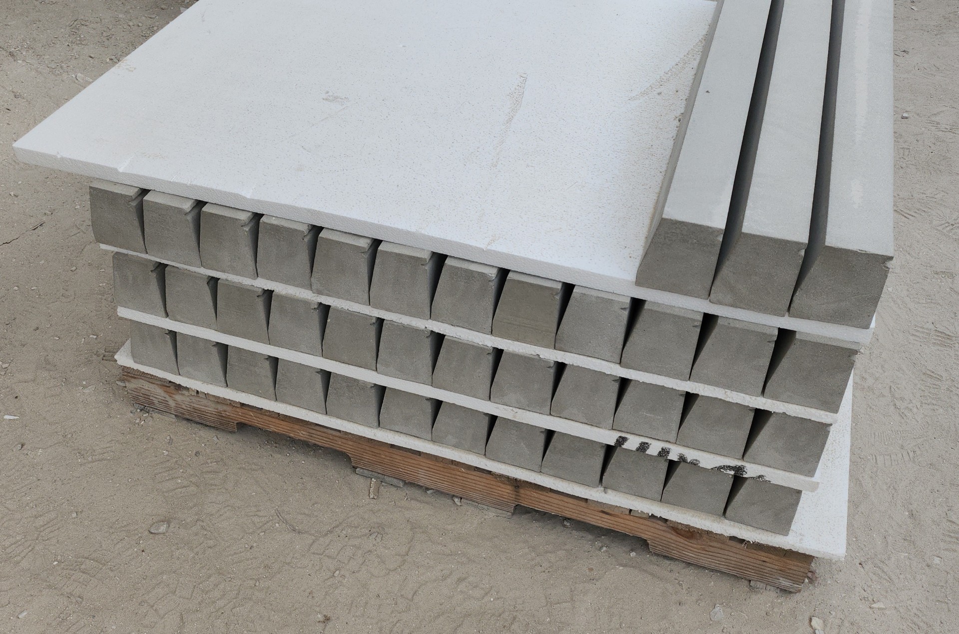 Stacked cast stone window sills and headers on a pallet ready for delivery